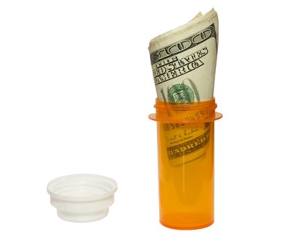 Prescrption bottle and cash, showing how expensive medicine is.
