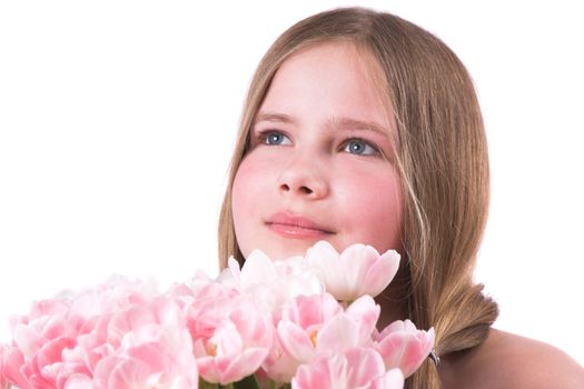 Beautiful little girl giving a bouquet of pink tulips