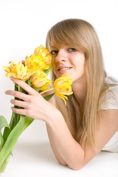 Sexy girl with bright yellow tulips