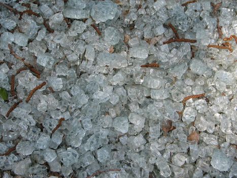 abstract broken glass background, glass used as garden mulch