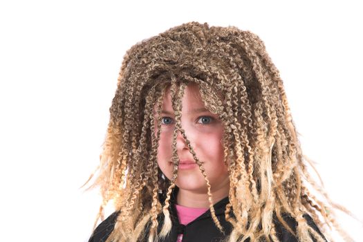 Little girl wearing a blond rasta wig