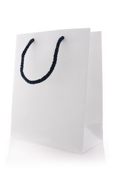 Isolated white shopping bag with blue handles 