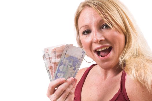 Pretty blond woman with an excited face holding some euro's