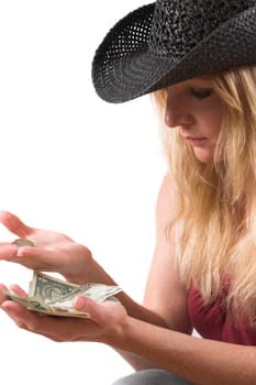 Pretty blond woman counting the money in her hands
