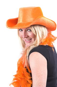 Happy blond woman with orange boa and orange hat