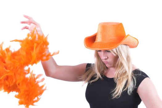 Pretty blond woman throwing away her orange boa after her team lost the game