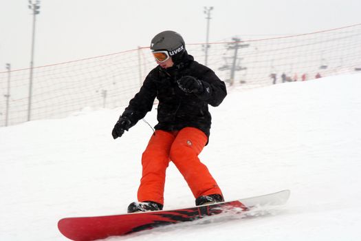 Snowboardman in red trousers