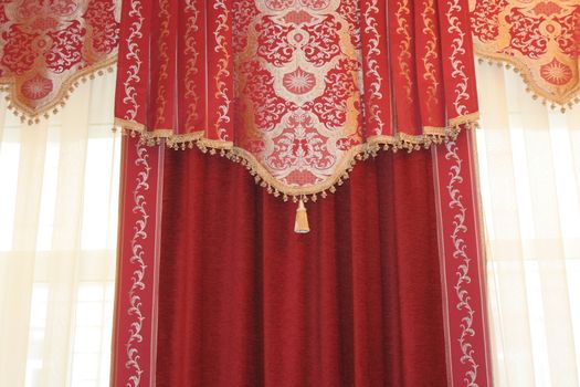 Drapery at a window. Red