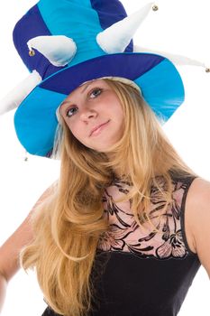 The attractive blonde in a foolish cap in studio