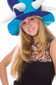 The attractive blonde in a foolish cap in studio