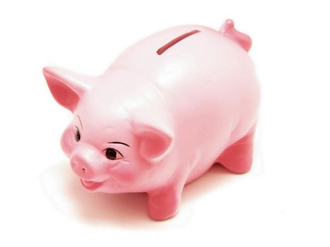 A cute piggy bank isolated on a white background.