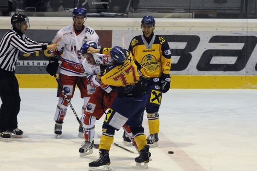 ZELL AM SEE, AUSTRIA - NOVEMBER 30: Austrian National League. Fight between Volker Keidl and Florian Graf. Game EK Zell am See vs. ATSE Graz (Result 0-4) on November 30, 2010, at hockey rink of Zell am See