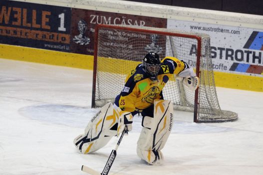 ZELL AM SEE, AUSTRIA - NOVEMBER 30: Austrian National League. Goalie Bartholomaeus charging to players bench. Game EK Zell am See vs. ATSE Graz (Result 0-4) on November 30, 2010, at hockey rink of Zell am See