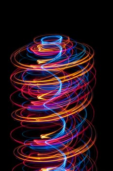 abstract helter skelter composed of spirals of glowing light