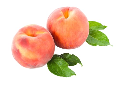 close-up ripe peaches with leaves, isolated on white