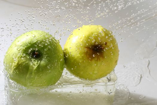 apple wash under water wet