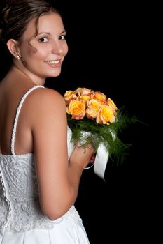 Beautiful smiling bride holding flowers