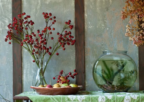 home still life of fish bowl and dried flowers