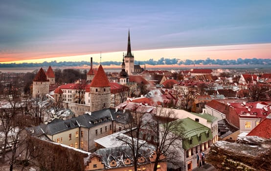 Overview of Tallinn in Estonia taken from the overlook in Toompea showing the town walls and churches. Taken in HDR to enhance the sunset