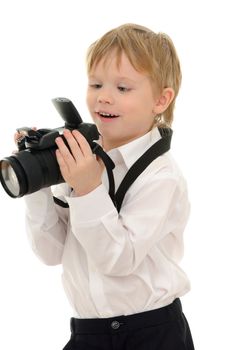 The child in a white shirt with the camera isolated on white background