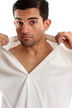 Handsome masculine man removing or putting on a shirt.  White background.