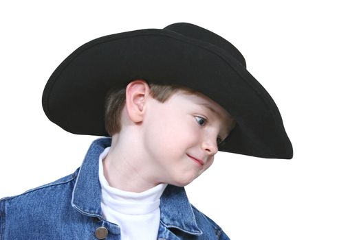 Four year old boy wearing a blue denim jacket and a black cowboy hat.  Shot with the Canon 20D.