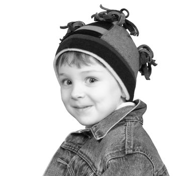 Four year old boy in crazy looking winter cap and a denim jacket.  Shot with the Canon 20D.