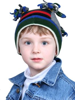 Four year old boy in crazy looking winter cap and a denim jacket.  Shot with the Canon 20D.