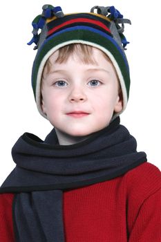 Four year old boy in crazy looking winter cap and a red sweater.  Shot with the Canon 20D.