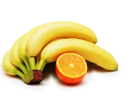 A bunch of ripe banana and orange on a white background - isolated