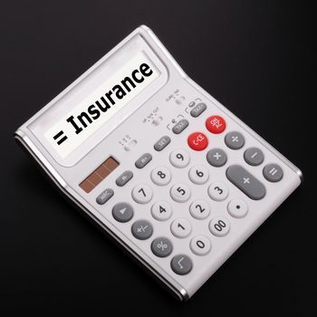 insurance or risk concept with calculator showing financial security