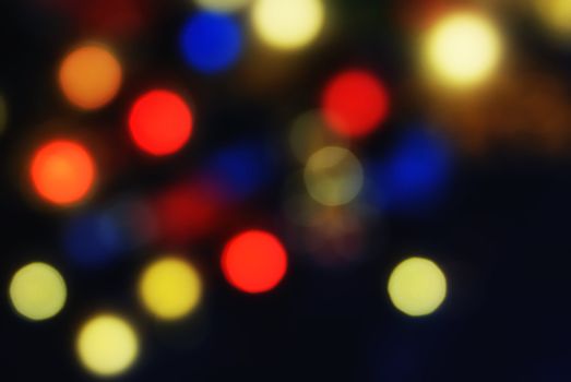 Christmas colorful background with blurred lights of xmas tree