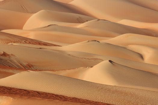 Abstract patterns in the dunes of the Rub al Khali or Empty Quarter. Straddling Oman, Saudi Arabia, the UAE and Yemen, this is the largest sand desert in the world.