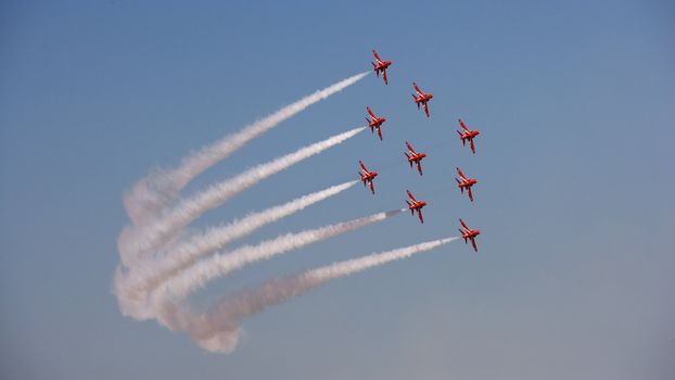 The Royal Air Force's Red Arrows team perform in their BAE Hawk aircraft at the Dubai Airshow in the United Arab Emirates.