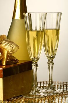 holiday card golden champagne and gift