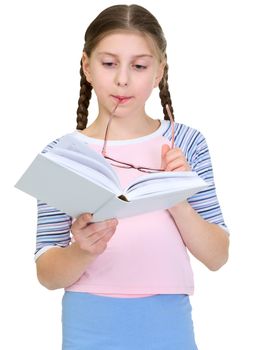 Schoolgirl reads the book on a white background