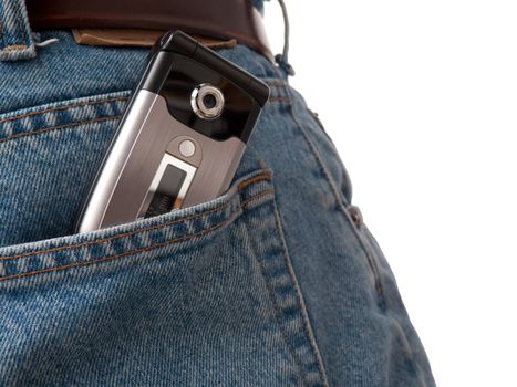 A closeup of a cellular phone in the back pocket of blue jeans, isolated on white.
