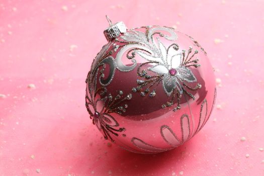 christmas card ball on pink background