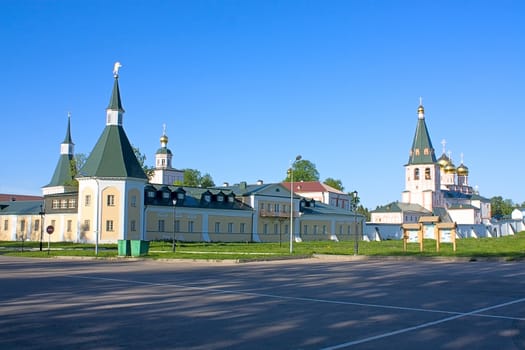 The road to Iversky monastery against blue sky, Russia.