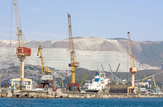 Tower cranes to load cargo ships in  port of Novorossiysk, Russia.