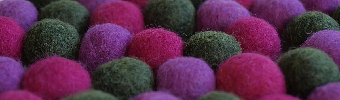 Felted wool ball necklace background