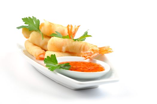 Deep fried shrimp rolls with spicy ginger dipping sauce.