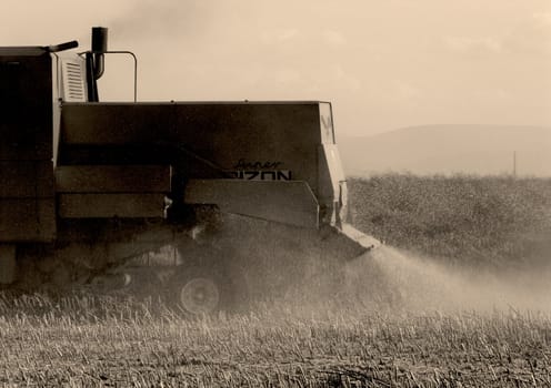 Big red combine performing his job