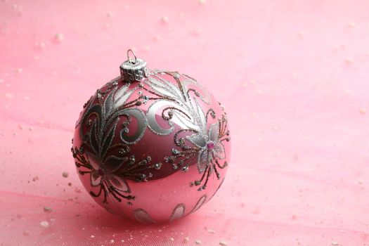 christmas card ball on pink background