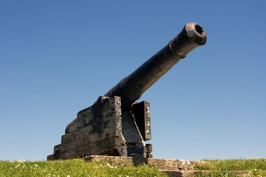 Old, rusty cannon. Tenby, Wales.