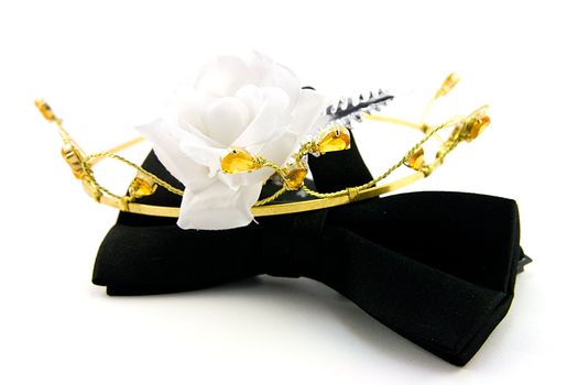 Single Black Bow Tie with Tiara and single white rose on a white Background