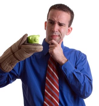 A young businesman is confused about his delicate investment, isolated against a white background