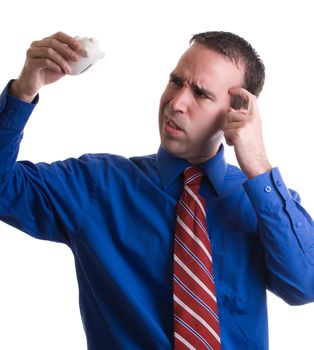 A businessman is looking confused because his savings are missing, isolated against a white background