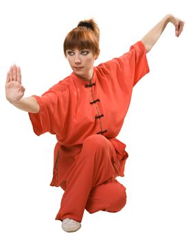 young woman makes kung-fu exercise isolated with clipping path on white background