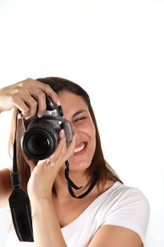 A young photographer shooting in the direction of the camera - in front of white background
 